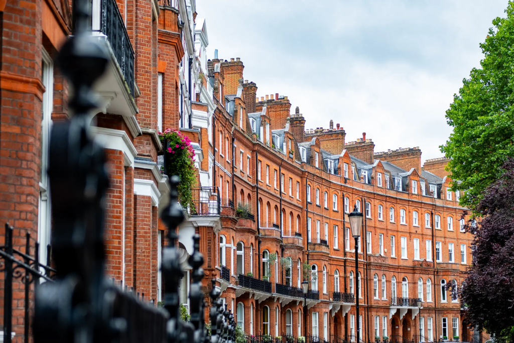 A row of red brick houses on a pretty London street | IIG Estates