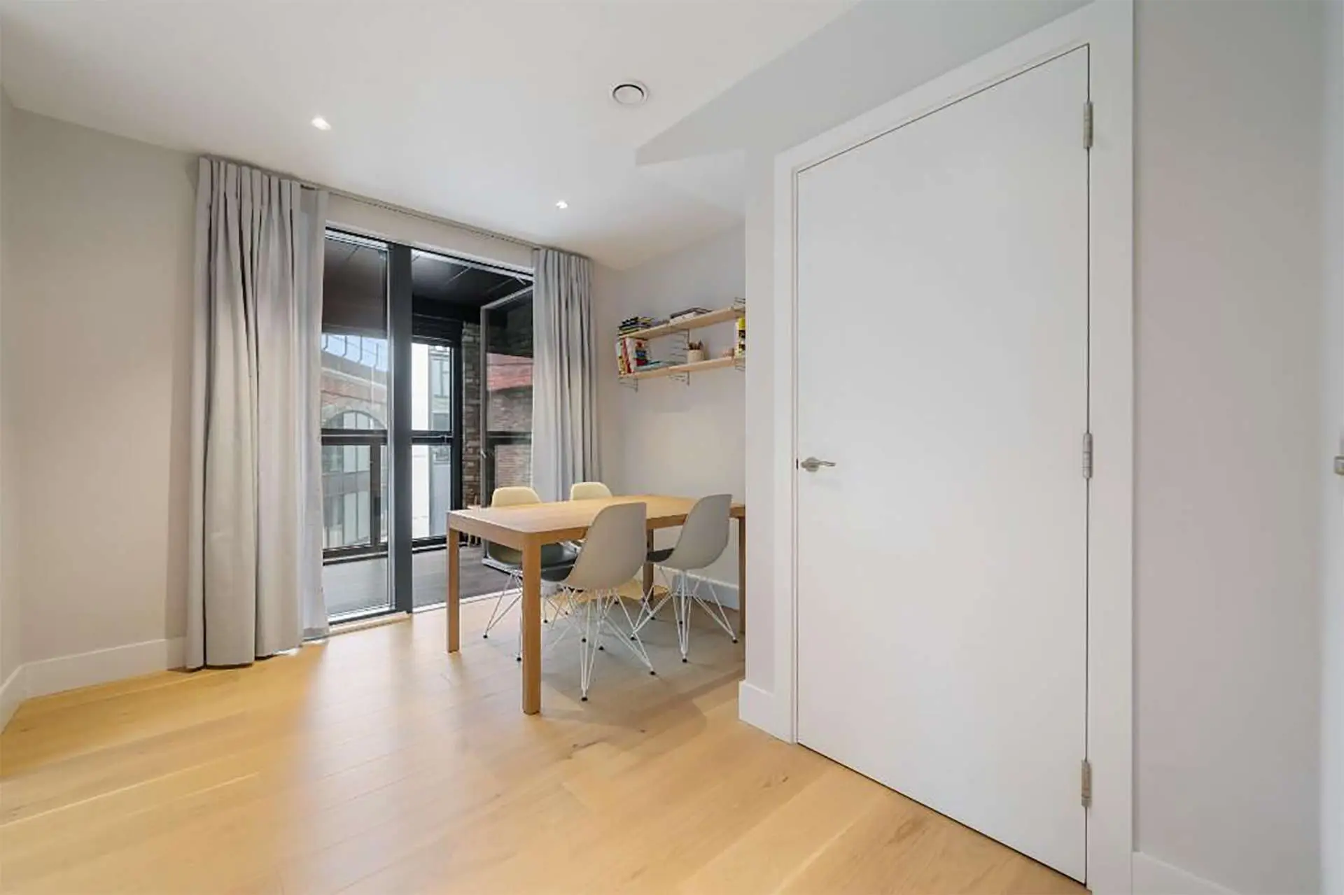 Dining room with balcony access in this 3 bedroom apartment in Patcham Terrace, London | IIG Estates