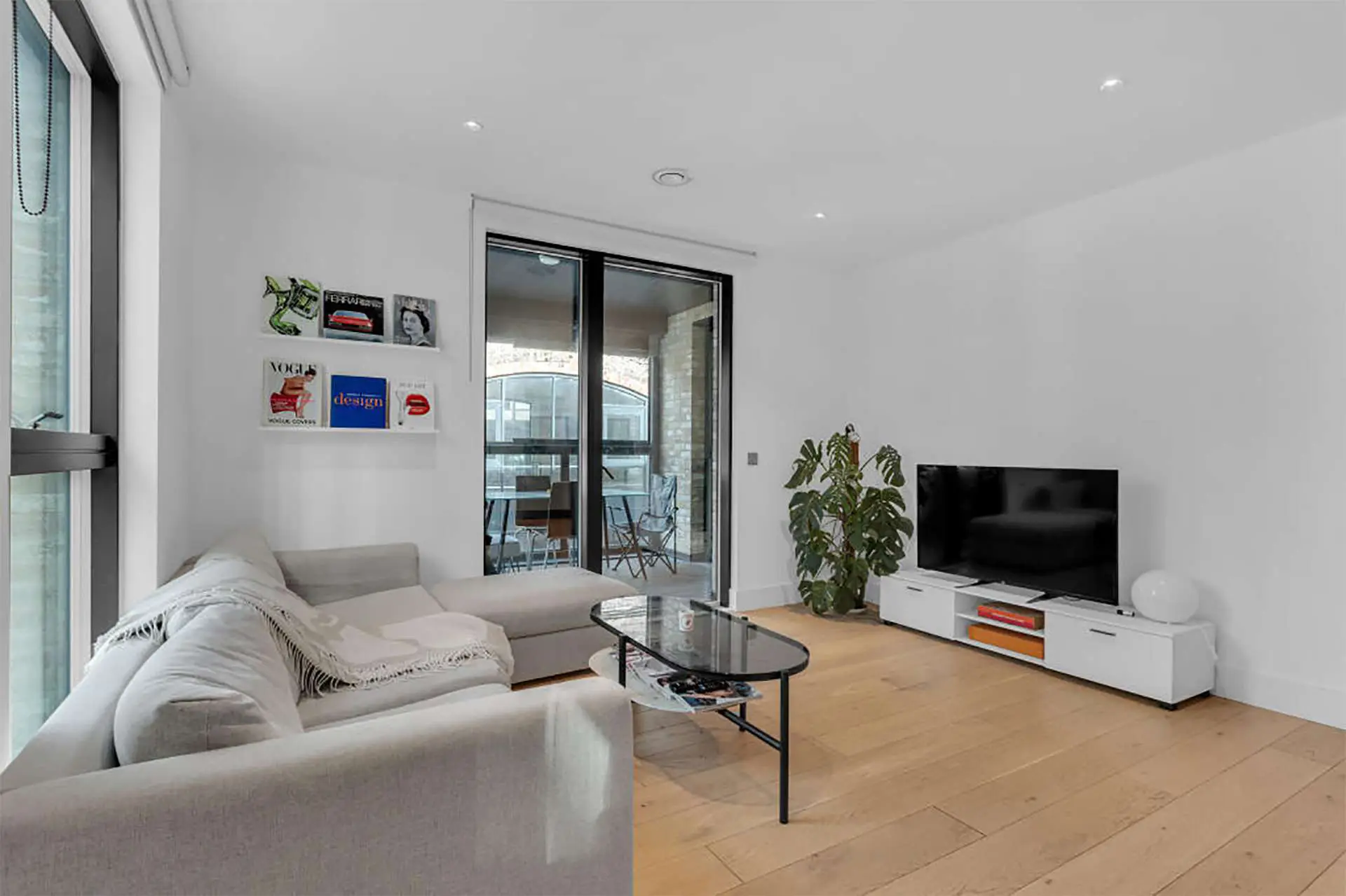 Open plan living space with exit to the terrace in Patcham Terrace London SW8 | IIG Estates